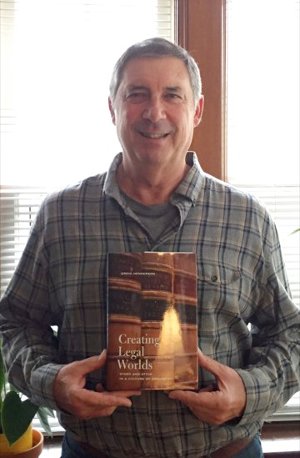 Picture of Greig Henderson with his book