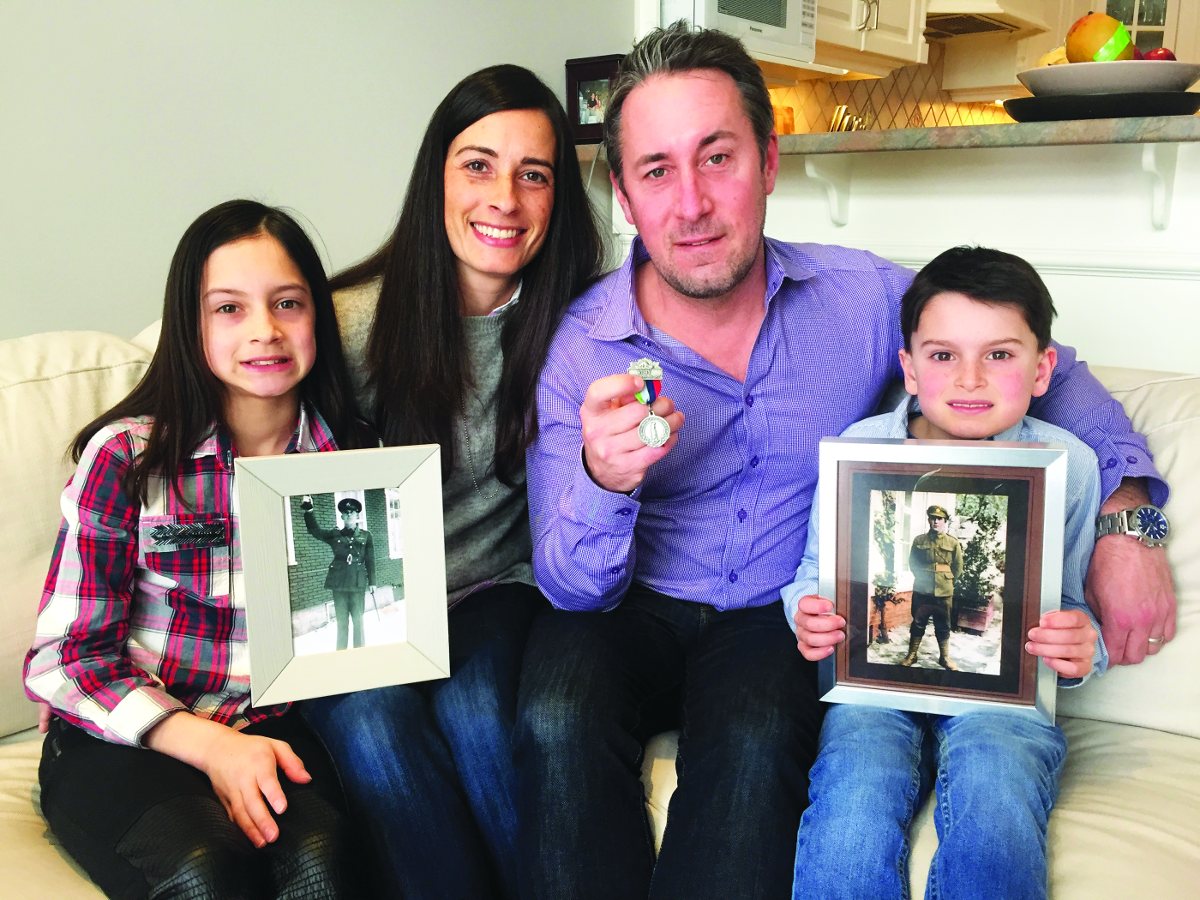 Drew and Erica Hamblin, of Sutherland Drive, with son Jack (7) holding photo of Drew’s grandfather Frank Edgar Hamblin as a private in France during WWI a few months before the Battle of Vimy Ridge.Daughter Paige (10) is holding a photo of Frank Edgar Hamblin during WWII when he served in Quebec. Drew is holding a Vimy medal produced by the Vimy Foundation. The family is headed to France at the end of March to visit the battlefields and cemeteries and to participate in the centenary commemorations on April 9th. Photo By Allan Williams.