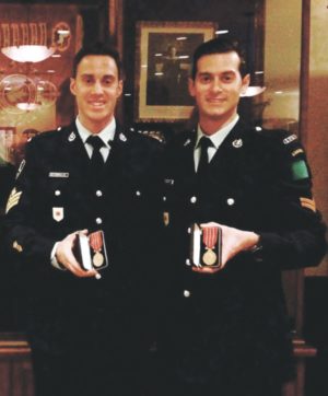 David Nespolo (right) and his best friend Michael are decorated in recognition of 12 years of military service.