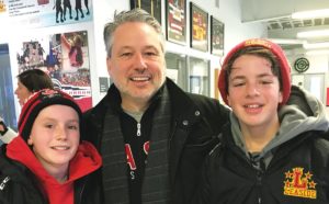 Leaside AA Flames teammates Nicholas Munn and Stas Mironova (right) played against each other. Nicholas goes to Bessborough and Stas goes to Northlea. Here they pose with Nicholas’s dad Jeff Munn.