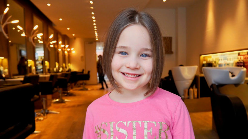 6-year-old Hadley Spraggs shows off her new short ’do after the cut for cancer.