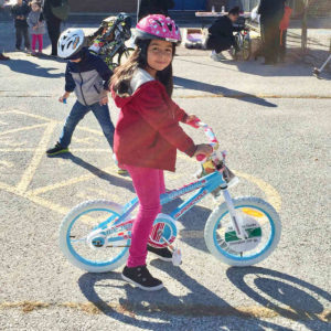 Valerie, age 8, was one of the 30 kids who received a new bike, helmet and lock.