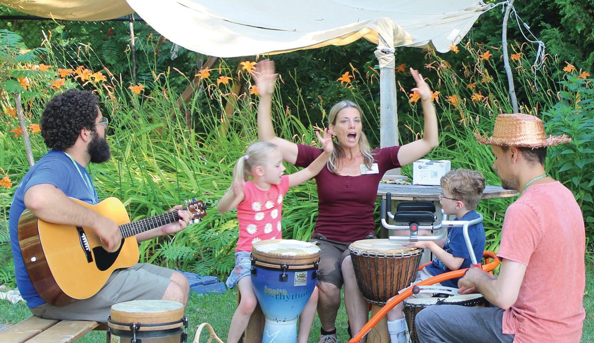 Holland Bloorview’s Spiral Garden staff artists (l-r), Thiago, Lynn and Marek share the Music Circle with participants Kate and Zach.