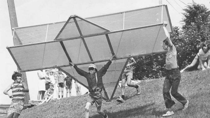 Children flying a homemade plane.