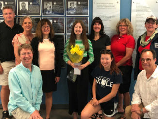 Back row l-r: board member Andrew Smyth, board president Jennifer Smith, Erin Parsons’ mom Miah, Erin, board member Erin Loft, board member Beth Brotherstone, and Jenny Shaw. Front: Erin’s dad Jeff, sister Moranne, and board member Mark Schrutt.