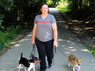 Dogwalker Alison Smith with her own dogs Baker and JD.