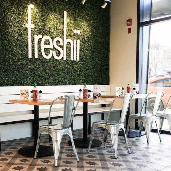 The interior of a Freshii restaurant.