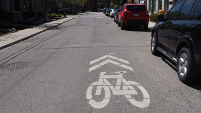 Sharrows (pictured here) indicate where cyclists should ride. For motorists, they are a reminder to share the road. Photo City of Toronto.
