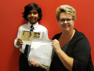 Kim from the Terry Fox Foundation gratefully accepts the cheque from Isaac. Photo Iqbal Khan.