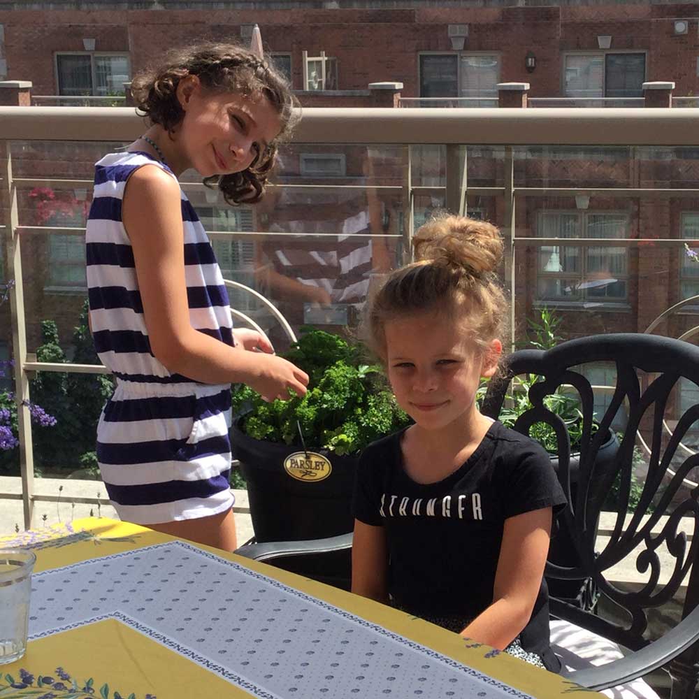 Scarlett, age 10, and Vienna on Pat’s balcony.