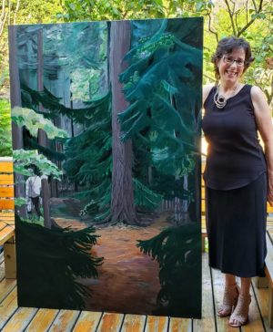 Celese with her painting Into the Woods. Photo by AILEEN CROWNE.