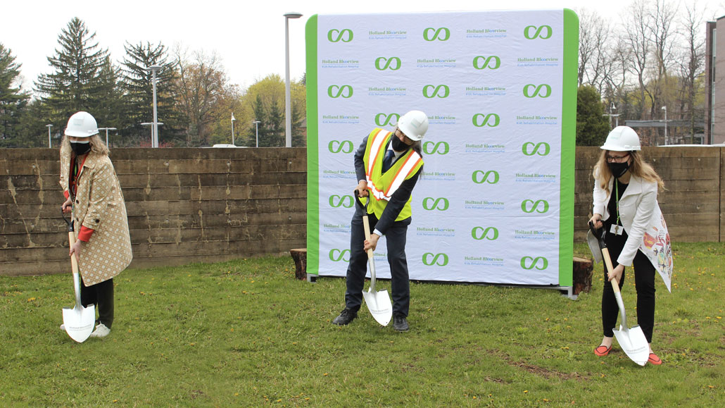 L-r: Julia Hanigsberg, President CEO, Tom Chau, Vice-President of Research, and Sandra Hawken, President and CEO of Holland Bloorview Foundation break ground on the hospital expansion. Photo from Holland Bloorview.