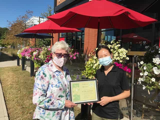 In August 2021 Nora Campbell, President presented the winner a certificate for the Community Award to Connie Lau, Manager of Aroma Espresso Bar in the Longo’s Plaza.