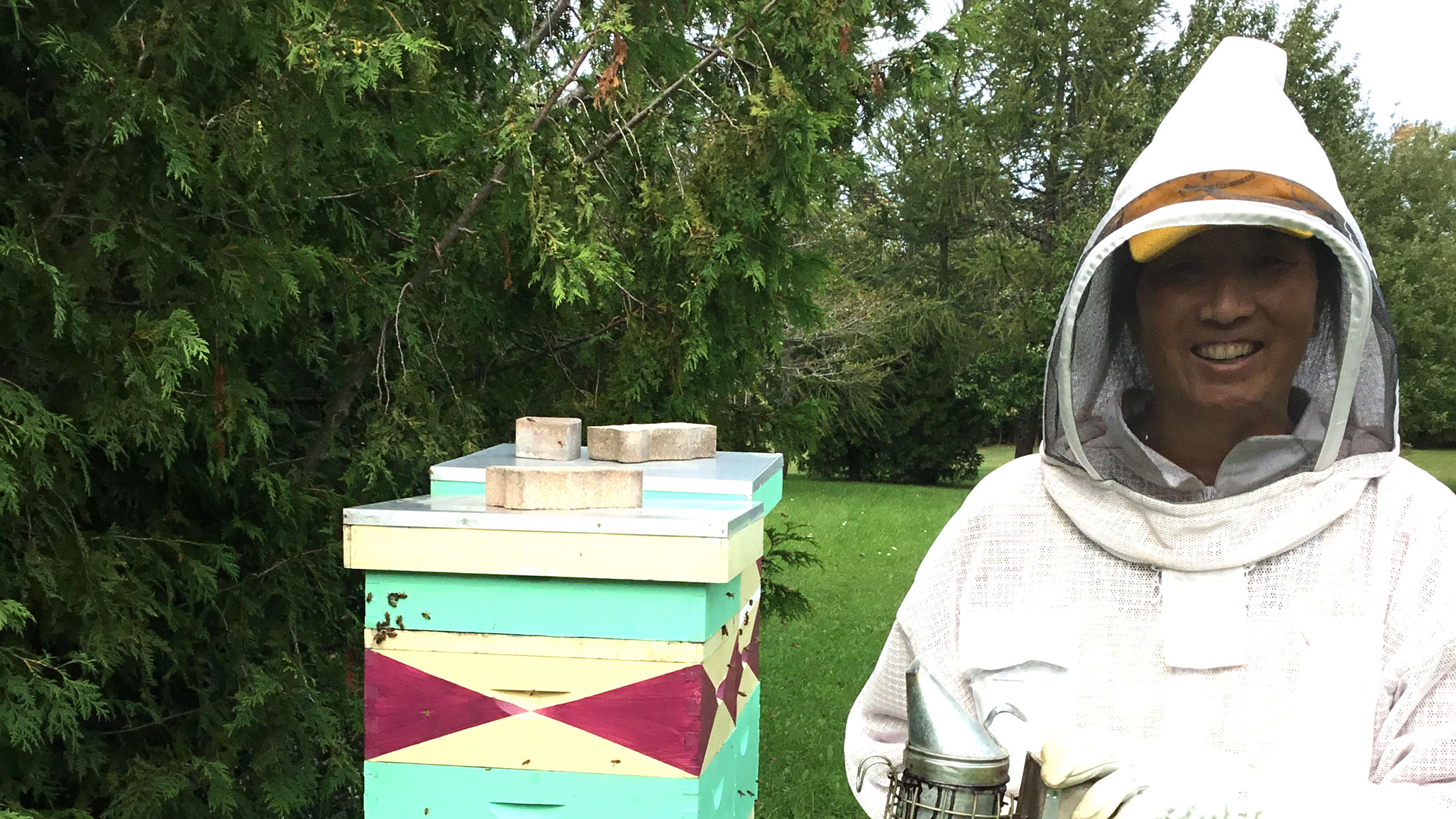 Julia Edey at work beekeeping.