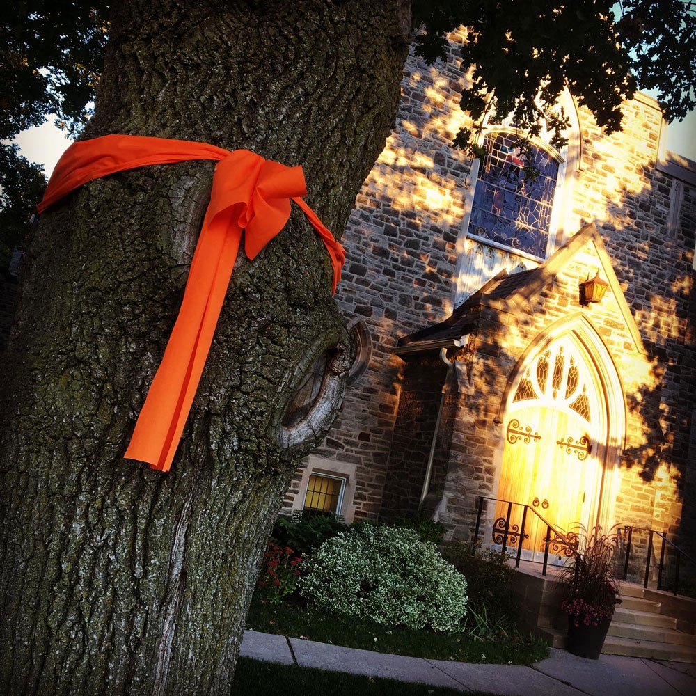 An Orange Ribbon is tied around a tree at Leaside United Church on September 30th in recognition of the first National Truth & Reconciliation Day. Photo by Michele Petick.