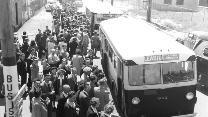 REL and other Leaside war workers board buses, 1943. Photo from TTC Archives.