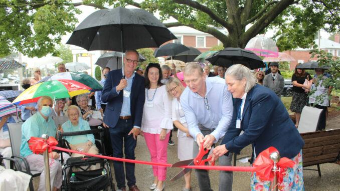 L-r: MP Rob Oliphant, MPP Stephanie Bowman, Trustee Rachel Chernos Lin, Committee chair Ian Beverley and the Reverend Canon Janet Read-Hockin cut the ribbon at the newly landscaped garden on Bayview.