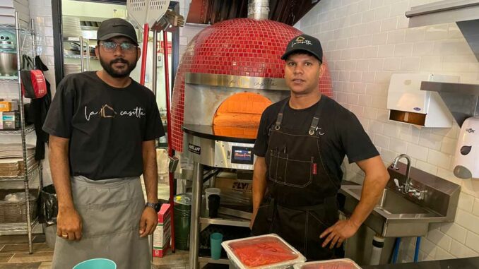 Chefs Teja and Surren with the pizza oven. Photo Janis Fertuck.