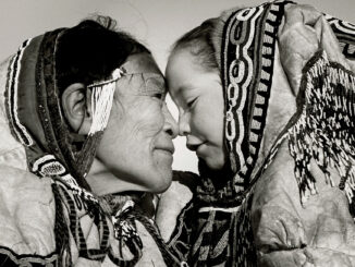 “AMONG ESKIMO NOSE-RUBBING IS LIKE KISSING BUT ONLY AMONG OLD AND YOUNG” PADLEI, NWT, CANADA, 1950. © ESTATE OF RICHARD HARRINGTON / COURTESY STEPHEN BULGER GALLERY