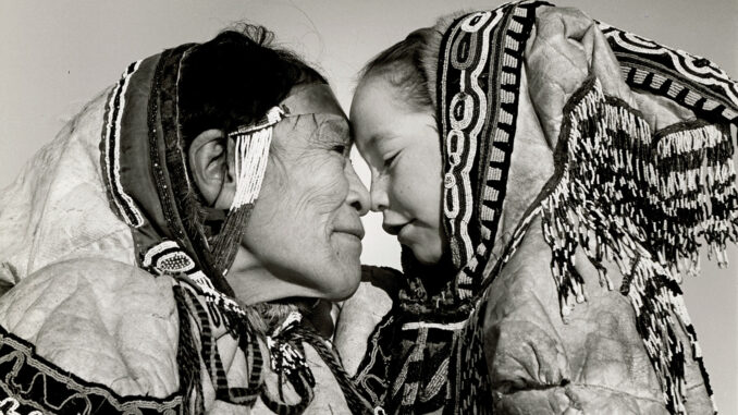 “AMONG ESKIMO NOSE-RUBBING IS LIKE KISSING BUT ONLY AMONG OLD AND YOUNG” PADLEI, NWT, CANADA, 1950. © ESTATE OF RICHARD HARRINGTON / COURTESY STEPHEN BULGER GALLERY