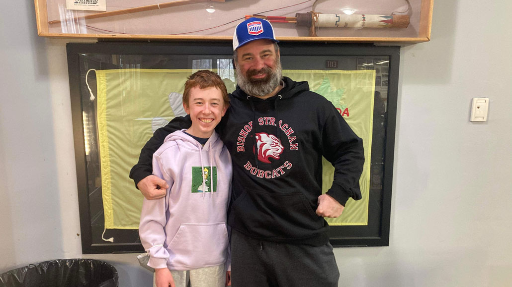 Shawn with an archery student. Photo Michelle Picard.