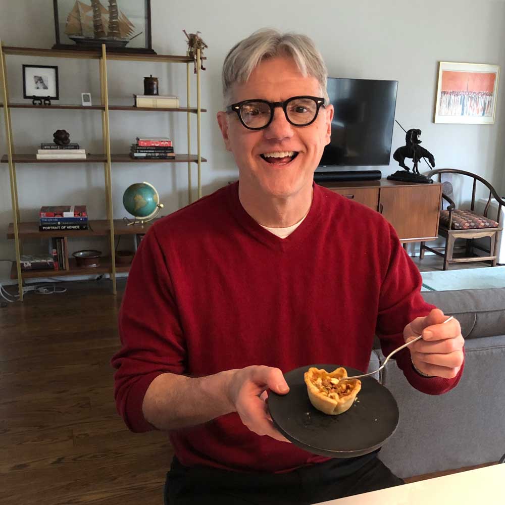 Mitch enjoying Helen's nutter butter tarts.